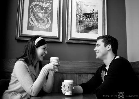 engaged couple laughing at Starbucks during their NYC engagement session