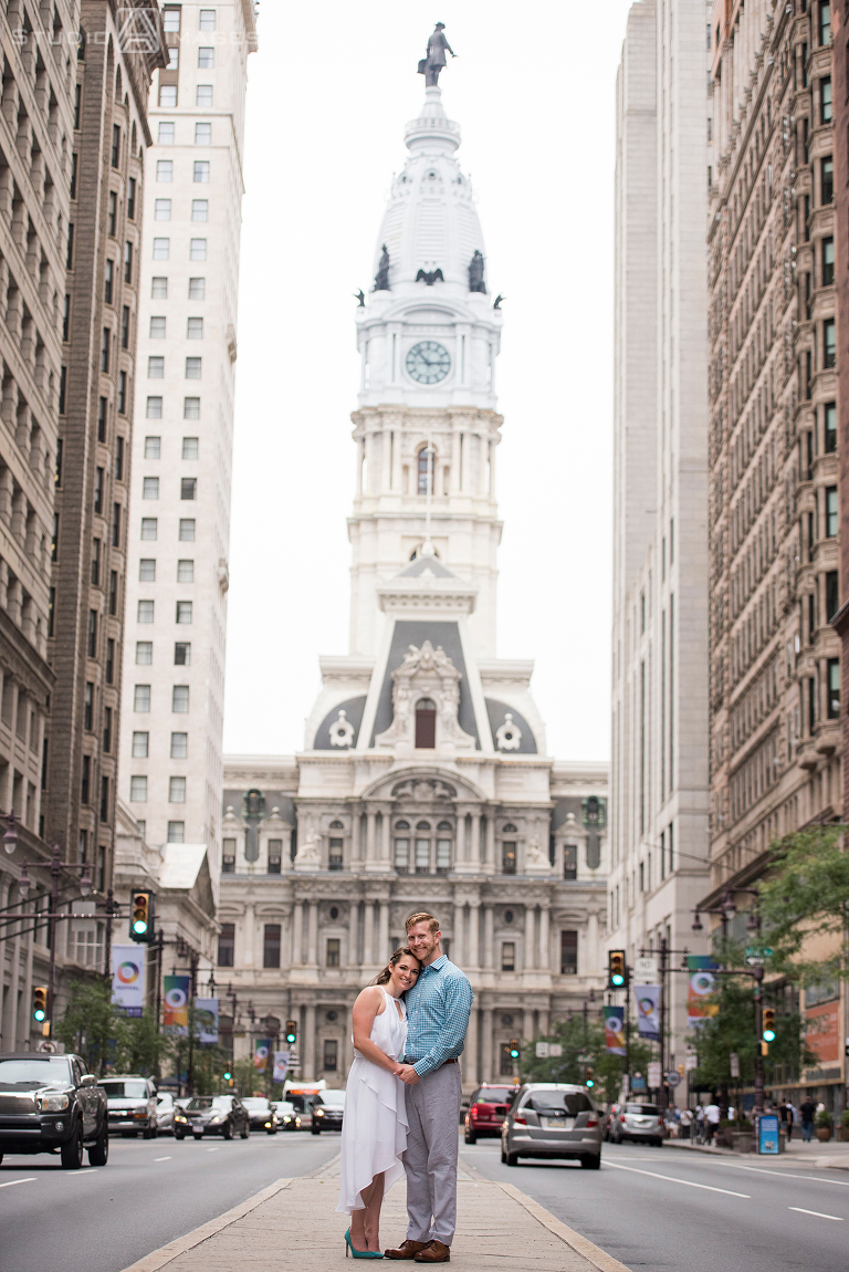 couple in front of City Hall in Philadelphia for their engagement photos