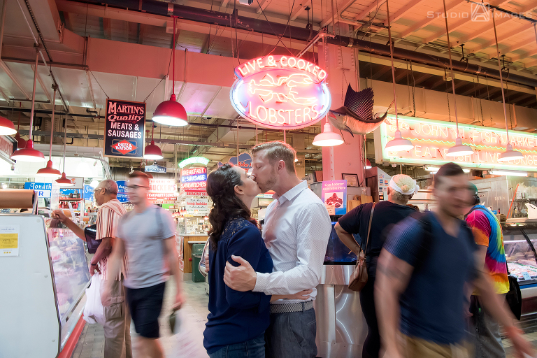 couple at Reading Terminal Market for their engagement photos