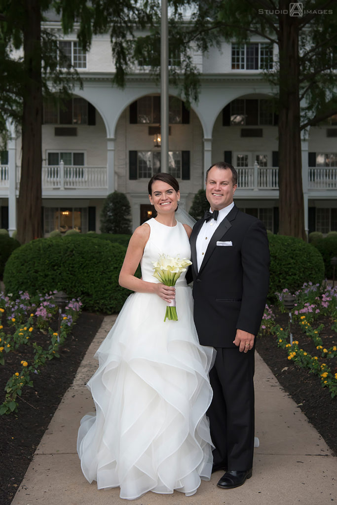 Bride and groom smiling on their wedding day at The Madison Hotel in Morristown.