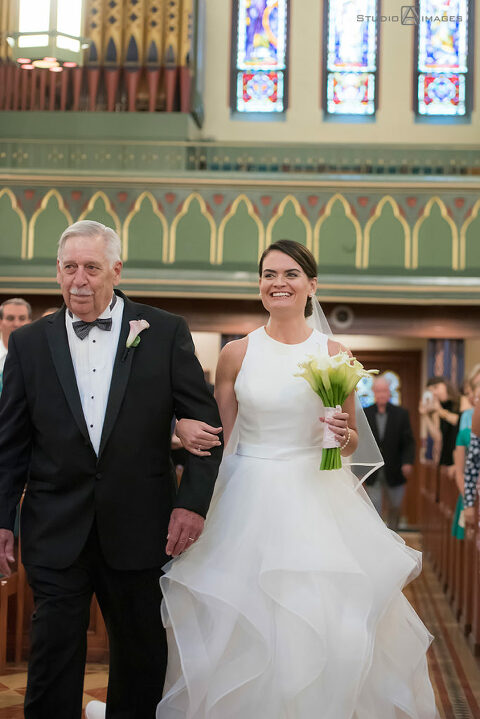 bride and her father walking down the aisle on her wedding day in Morristown