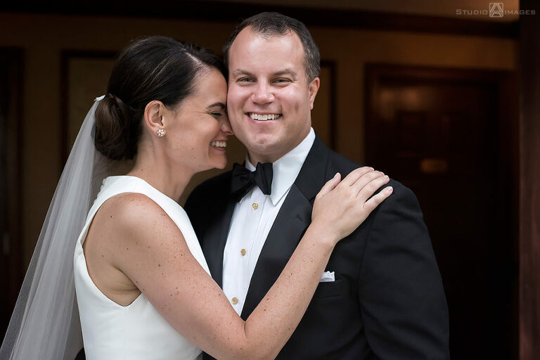 Bride and groom smiling on their wedding day at The Madison Hotel in Morristown. 