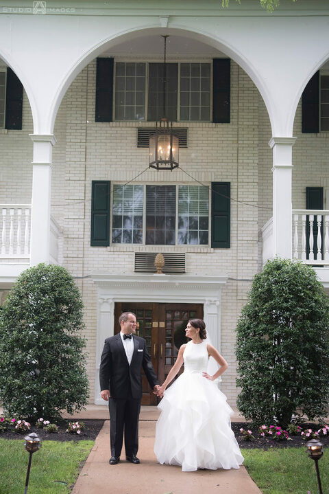Bride and groom smiling on their wedding day at The Madison Hotel in Morristown. 