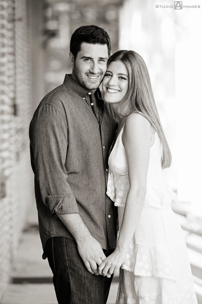 couple posing for their engagement photos at Governors Island