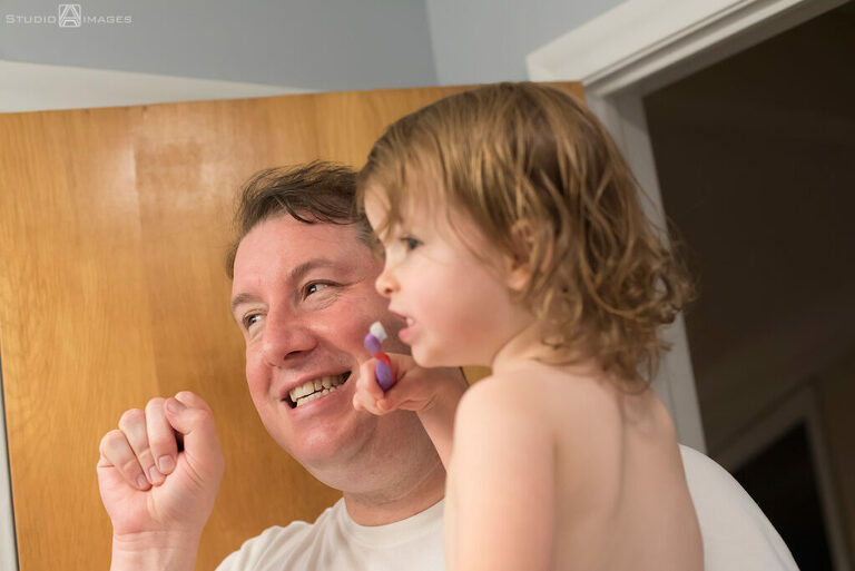 parents and daughter at bath time during their Documentary-style day in the life family photo shoot
