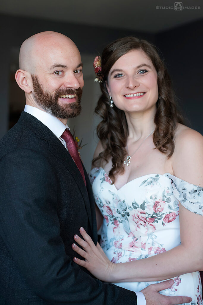 Bride and groom smiling before their wedding at Liberty House in Jersey City