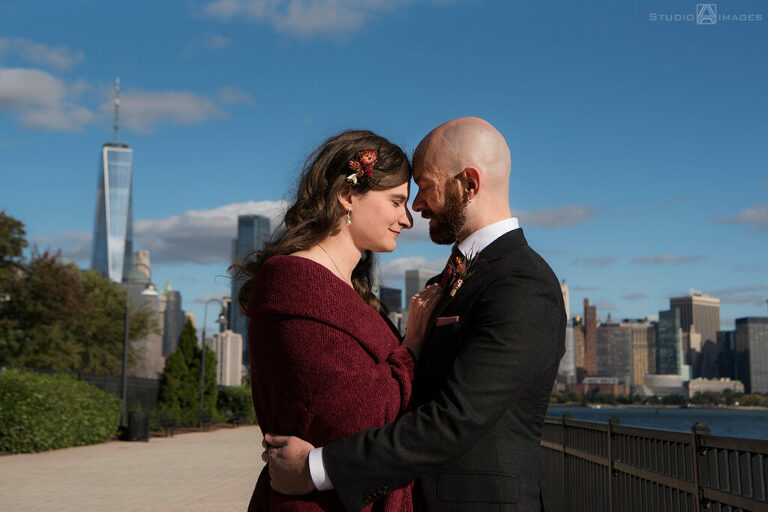 bride and groom posing for portraits before their wedding at Liberty House in Jersey City
