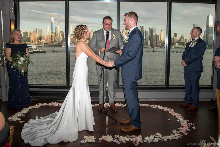 bride and groom during wedding ceremony at Molo's Restaurant in Weehawken