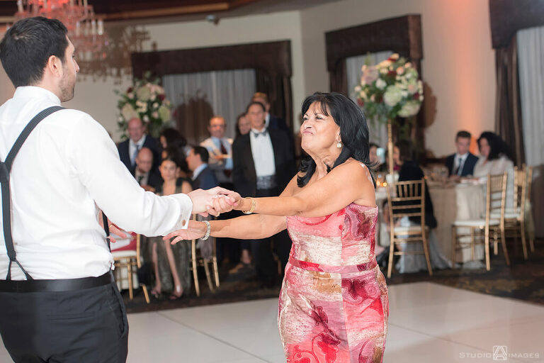 groom and mom dancing at wedding reception at Temple Emanu-El of Closter
