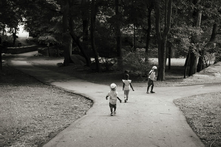 family running in the park during their Day in the Life family session in Scarsdale, New York