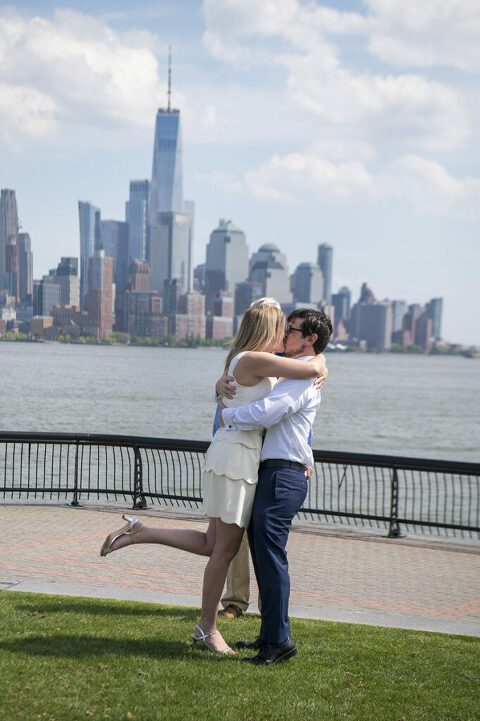 Wedding couple kisses during their socially distanced micro wedding ceremony on Pier A in Hoboken