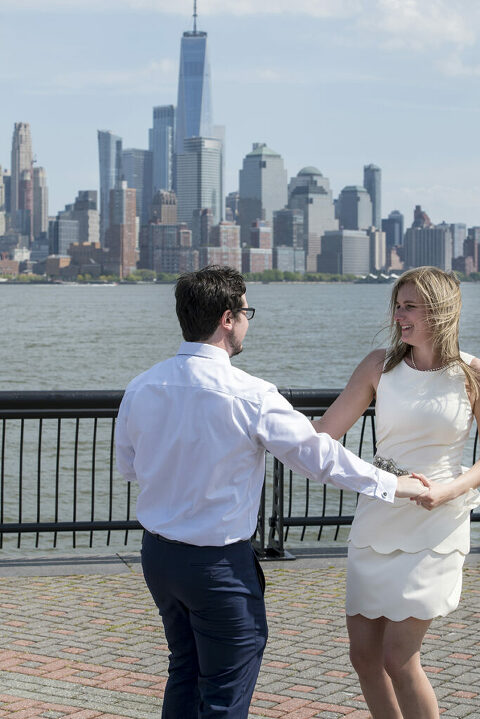 Couple dances their first dance after their micro wedding on Pier A in Hoboken