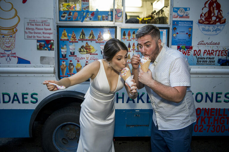 bride and groom eating ice cream from Mister Softee on their wedding day