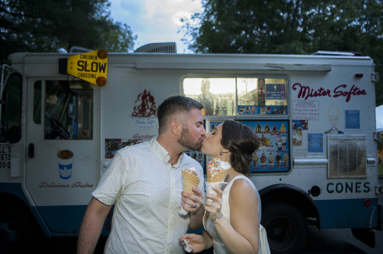 bride and groom eating ice cream from Mister Softee on their wedding day