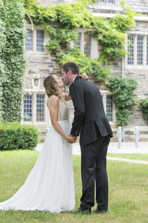 intimate wedding at Princeton University. Bride and groom kiss