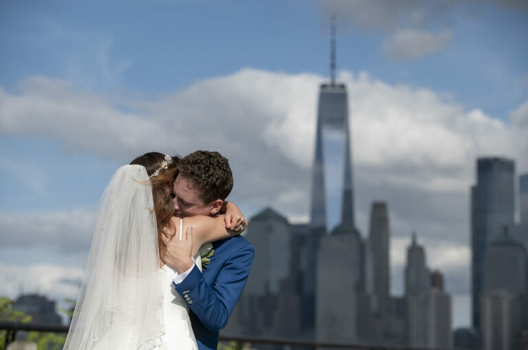 bride and groom first look on their wedding day with NYC skyline in the background