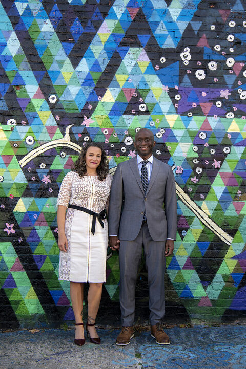 wedding couple in front of mural in Welling Court