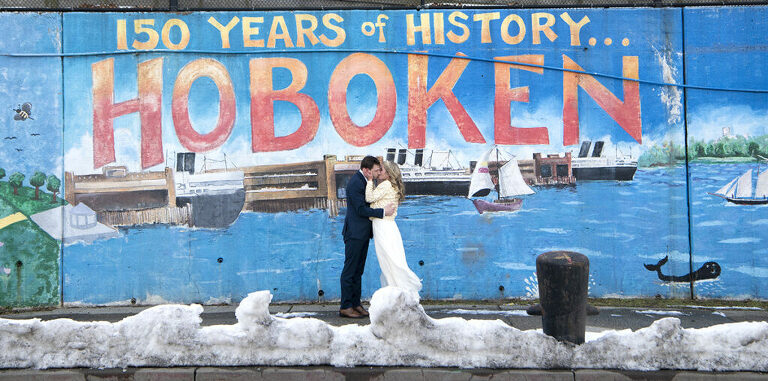Hoboken wedding couple in front of the Hoboken mural on their wedding day