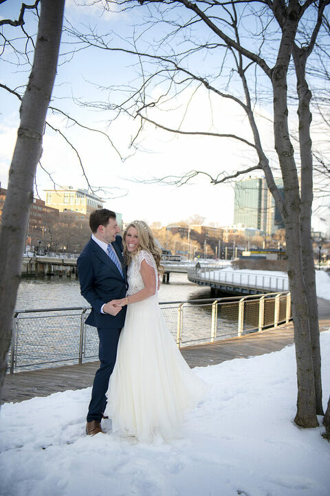 happy Hoboken wedding couple on their wedding day in Hoboken in the snow