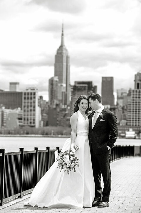 Bride and groom on their wedding day in Hoboken with NYC skyline 