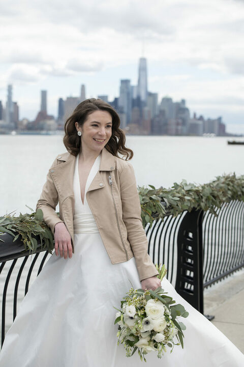 Bride on their wedding day in Hoboken with NYC skyline 