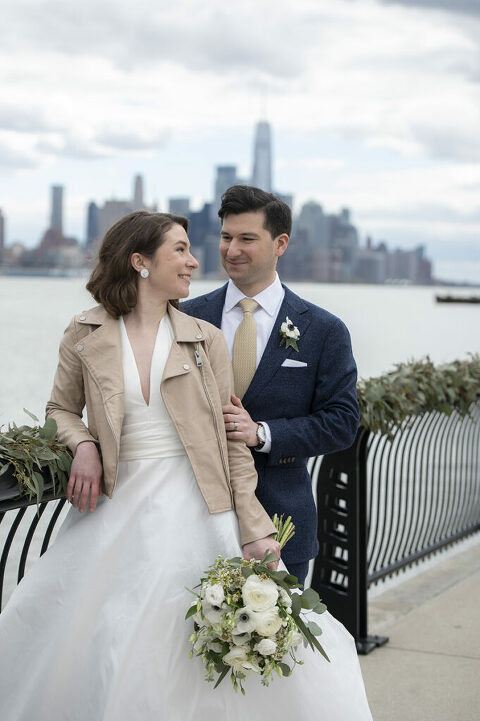Bride and groom on their wedding day in Hoboken with NYC skyline 