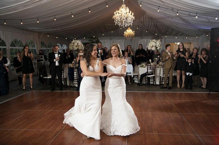 brides' first dance at wedding reception on wedding day at Windows on the Water at Frogbridge. LGBTQ wedding