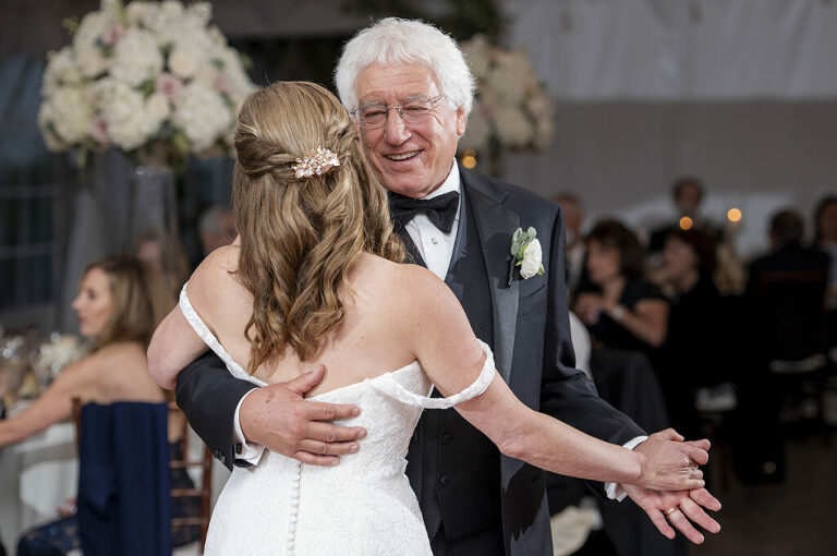 bride and her father at wedding reception on wedding day at Windows on the Water at Frogbridge. LGBTQ wedding
