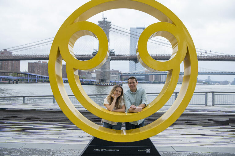 couple at South Street Seaport for their engagement session in NYC