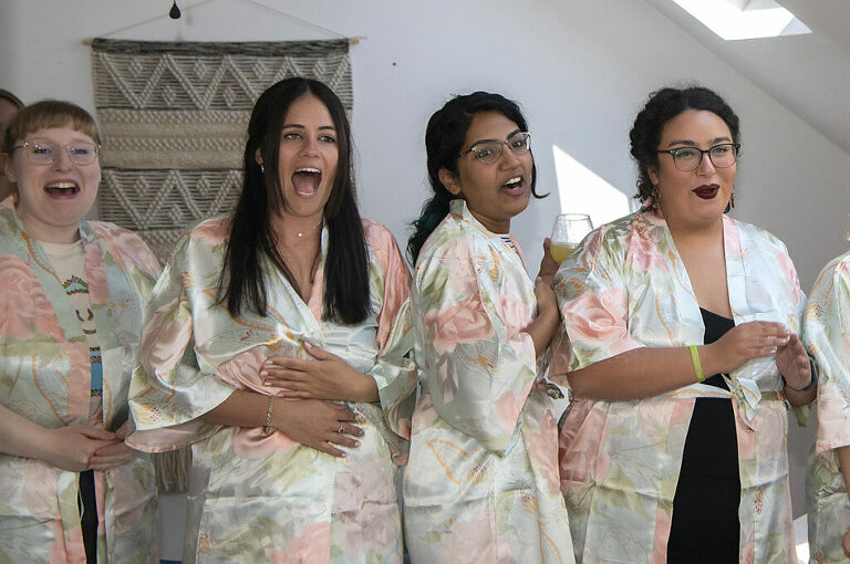 bridesmaids reacting to seeing bride on her wedding day in Atlantic Highlands | NJ Intimate Wedding Photographer