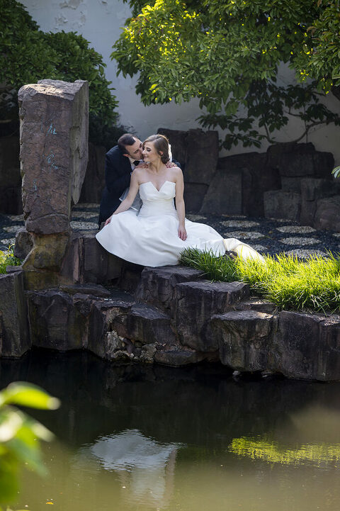 bride and groom on their wedding day at Celebrate at Snug Harbor botanical gardens