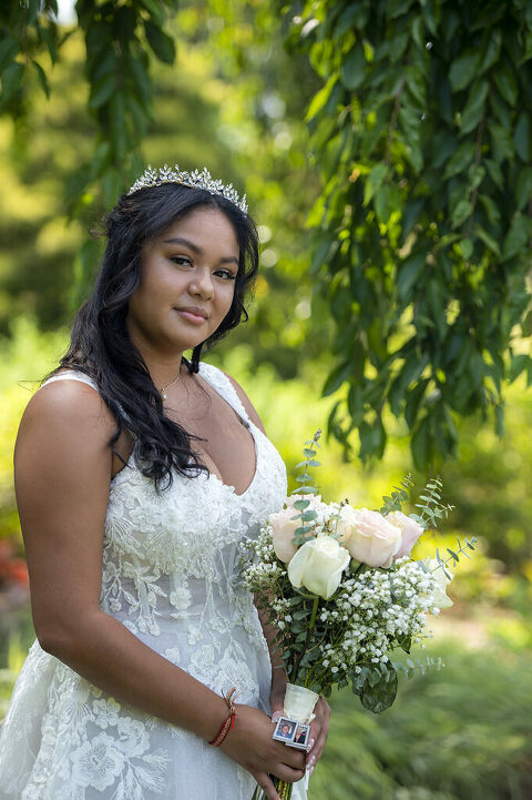 bride poses for portraits after their intimate Queens Botanical Garden wedding