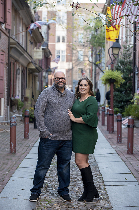 couple posing on Elfreths Alley in Philadelphia for their Old City Philly engagement session