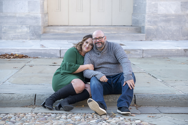 couple posing at Merchant Exchange Building in Philadelphia for their Old City Philly engagement session