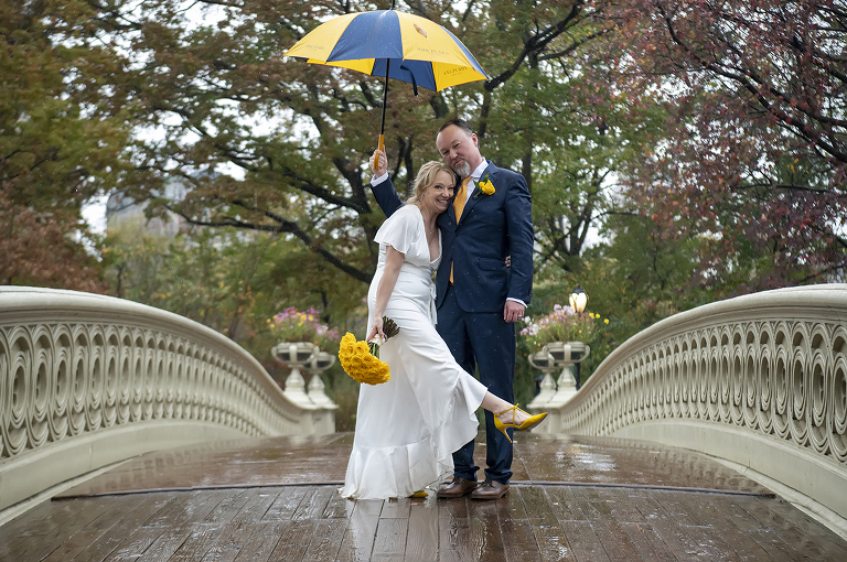 bride and groom in rain on their wedding day in Central Park, NYC
