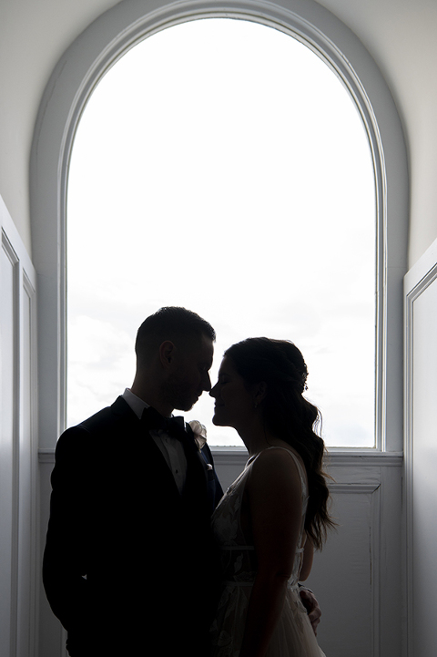 bride and groom silhouetted on their wedding day at Hudson House in Jersey City