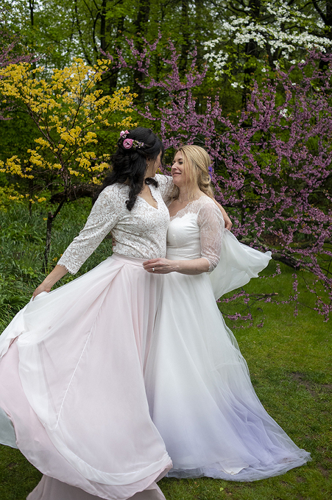 Two brides pose for portraits at Reeves-Reed Arboretum Wedding | LGBTQ wedding photographer