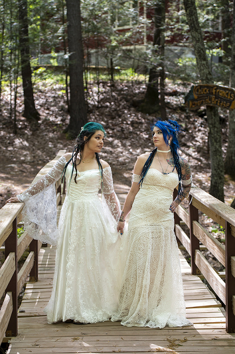 brides in the forest on their wedding day at Riedlbauer’s Resort in the Catskills. LGBTQ wedding