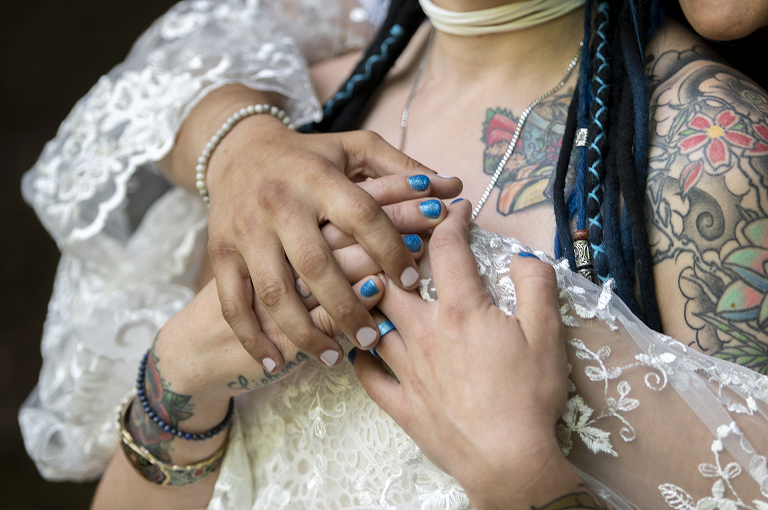 brides in the forest on their wedding day at Riedlbauer’s Resort in the Catskills. LGBTQ wedding