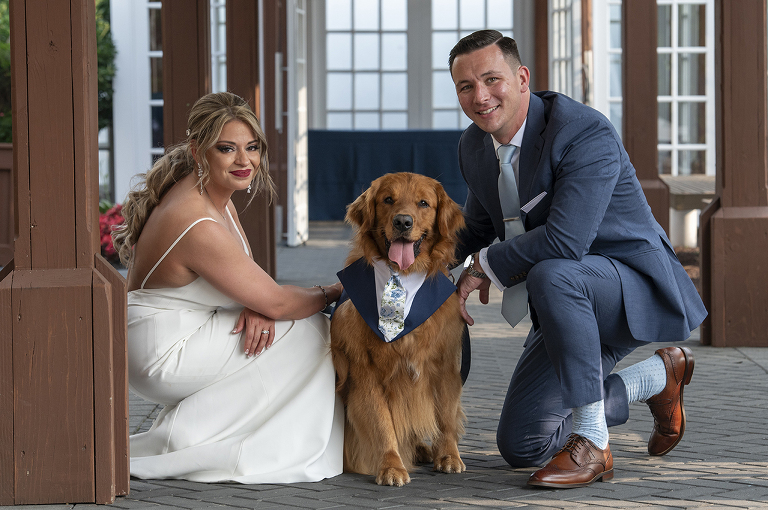 bride and groom with their dog on wedding day at Liberty House in Jersey City