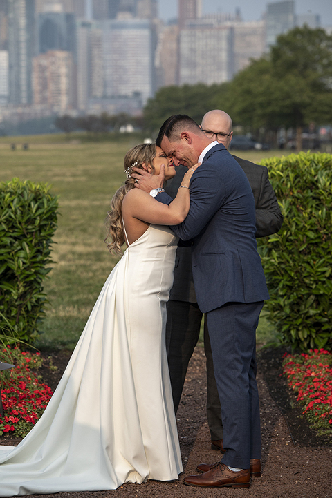 wedding ceremony with NYC skyline at Liberty House in Jersey City