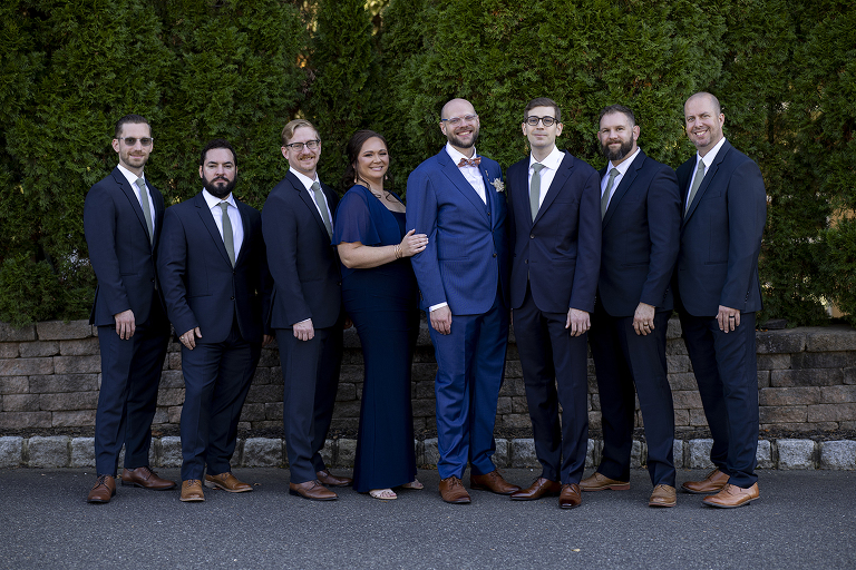 groom with their wedding party at fall wedding at Stone House at Stirling Ridge