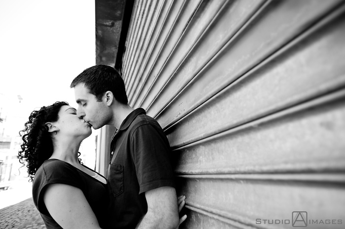 engaged couple on Court Street during their Hoboken engagement session