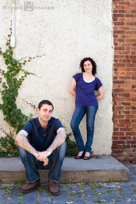 engaged couple on Court Street during their Hoboken engagement session