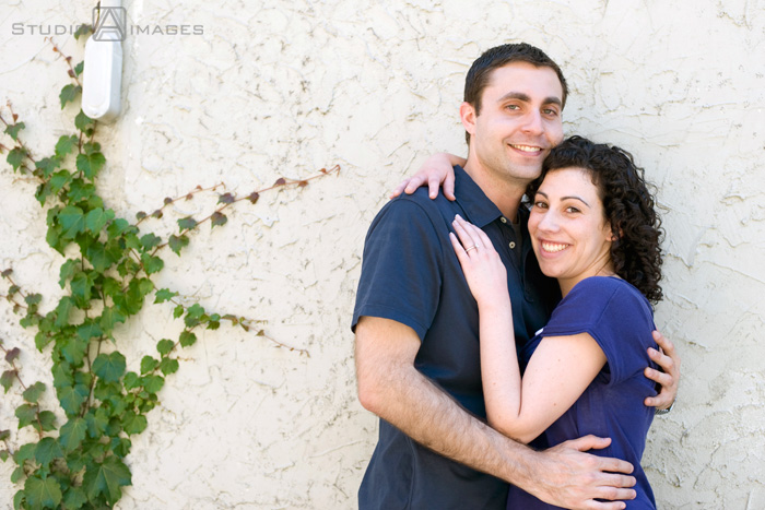 engaged couple on Court Street during their Hoboken engagement session
