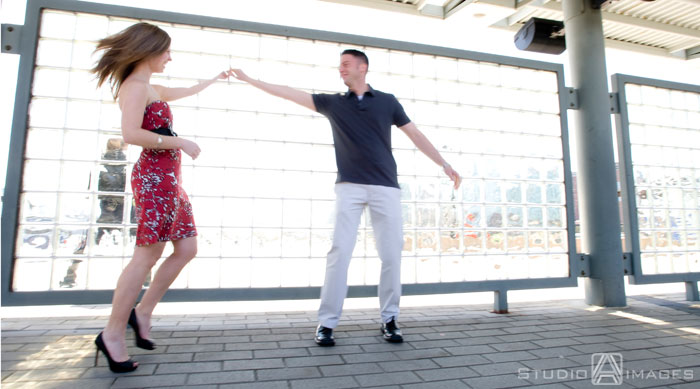 engaged couple dancing in front of glass wall, Couples, Engagement, Bayonne, Magic Fountain Ice Cream, Hoboken, Love, NJ, NJ wedding photography, Photography, Portraits, Studio A Images, wedding photography, engagement photography