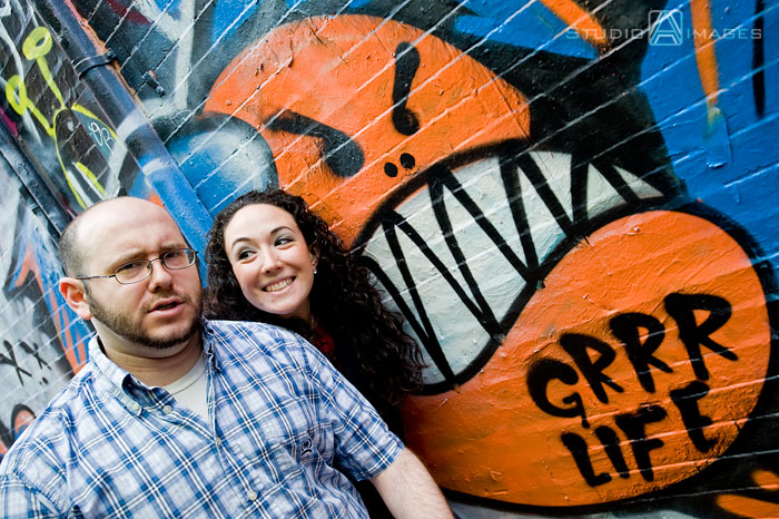 Cambridge, graffiti, Couples, Engagement, engagement photography, engagement photos, Love, MA, Massachusetts, Massachusetts wedding photography, Photography, Portraits, Studio A Images, wedding photography, Massachusetts engagement photos, Cambridge engagement photos, rainy day photos, umbrellas
