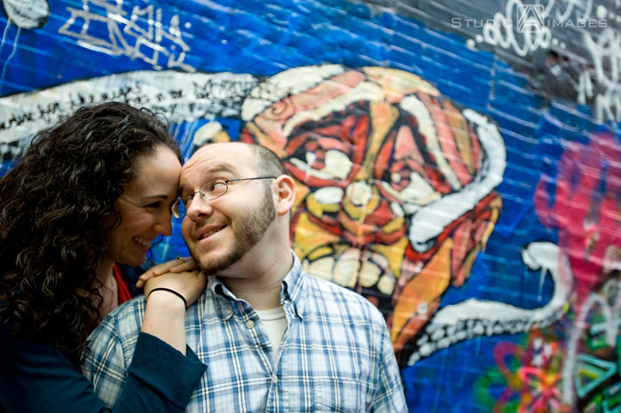 Cambridge, graffiti, Couples, Engagement, engagement photography, engagement photos, Love, MA, Massachusetts, Massachusetts wedding photography, Photography, Portraits, Studio A Images, wedding photography, Massachusetts engagement photos, Cambridge engagement photos, rainy day photos, umbrellas