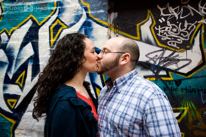 Cambridge, graffiti, Couples, Engagement, engagement photography, engagement photos, Love, MA, Massachusetts, Massachusetts wedding photography, Photography, Portraits, Studio A Images, wedding photography, Massachusetts engagement photos, Cambridge engagement photos, rainy day photos, umbrellas
