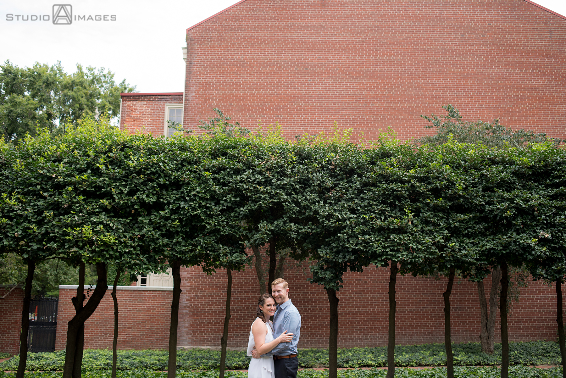 couple at 18th century garden in Philadelphia for their engagement photos